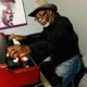 William Hollis. Image shows Hollis sitting at his keyboards